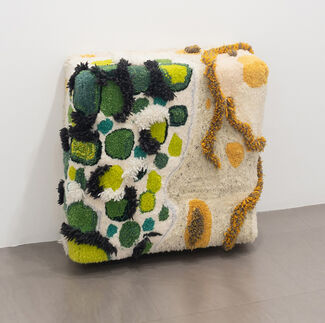Green, white, and yellow sculptural artwork. 