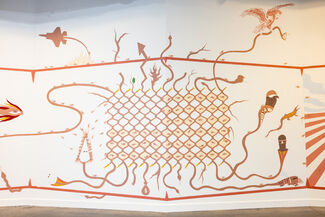 Large mural depicting different symbolic imagery.