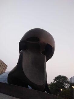 the reflective bronze of Moore’s sculpture