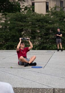 People in Nuclear Energy Plaza use AR to see the How do we trouble time exhibit