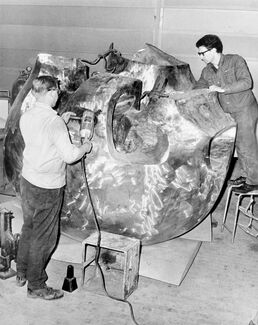 Black and white photo of Henry Moore in process of building the nuclear energy sculpture