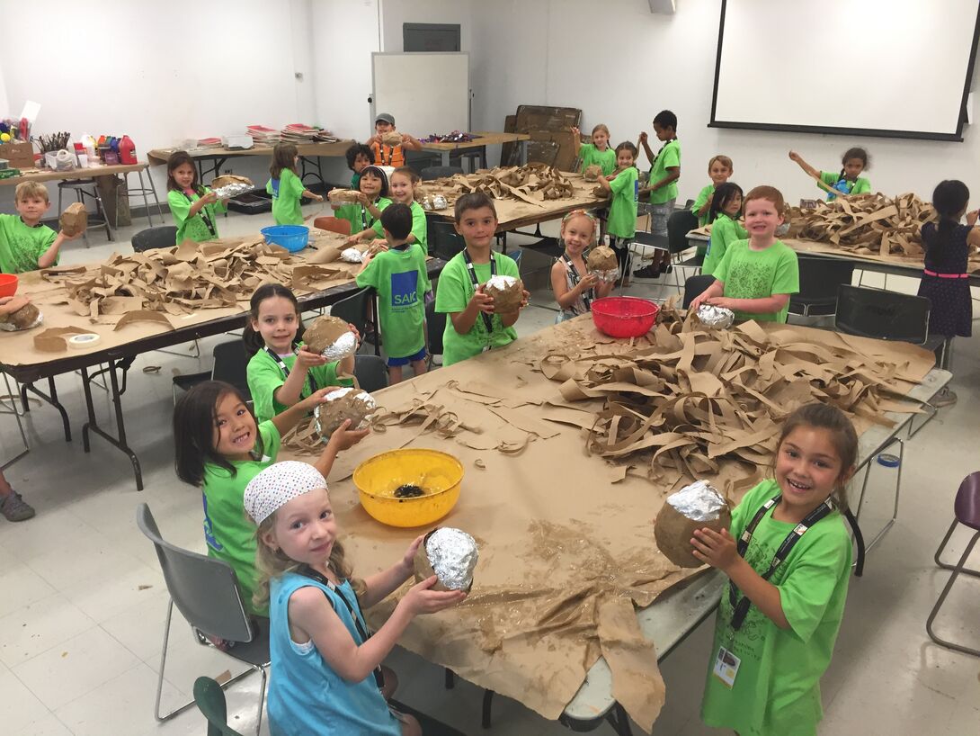 A large classroom with children. 