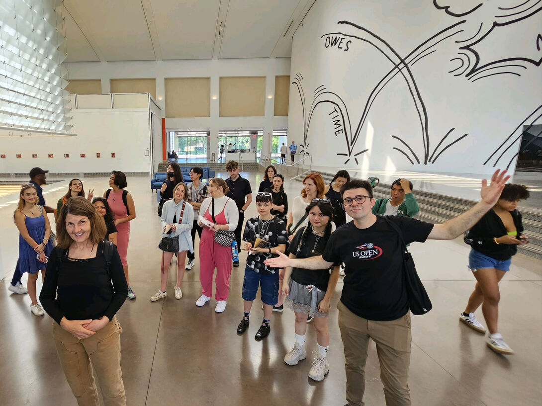 A group of students and faculty indoors
