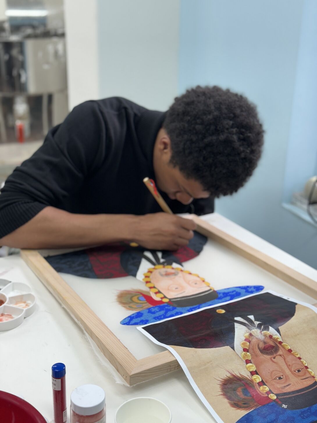 Thaddeus Martin works on copying a painting