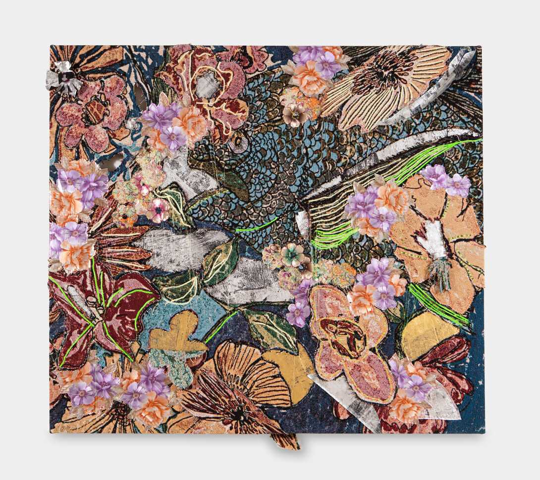A stretched textile featuring glittery, dense florals surrounding an open-mouthed fish. Some flowers jut out from the colorful, textured surface. 