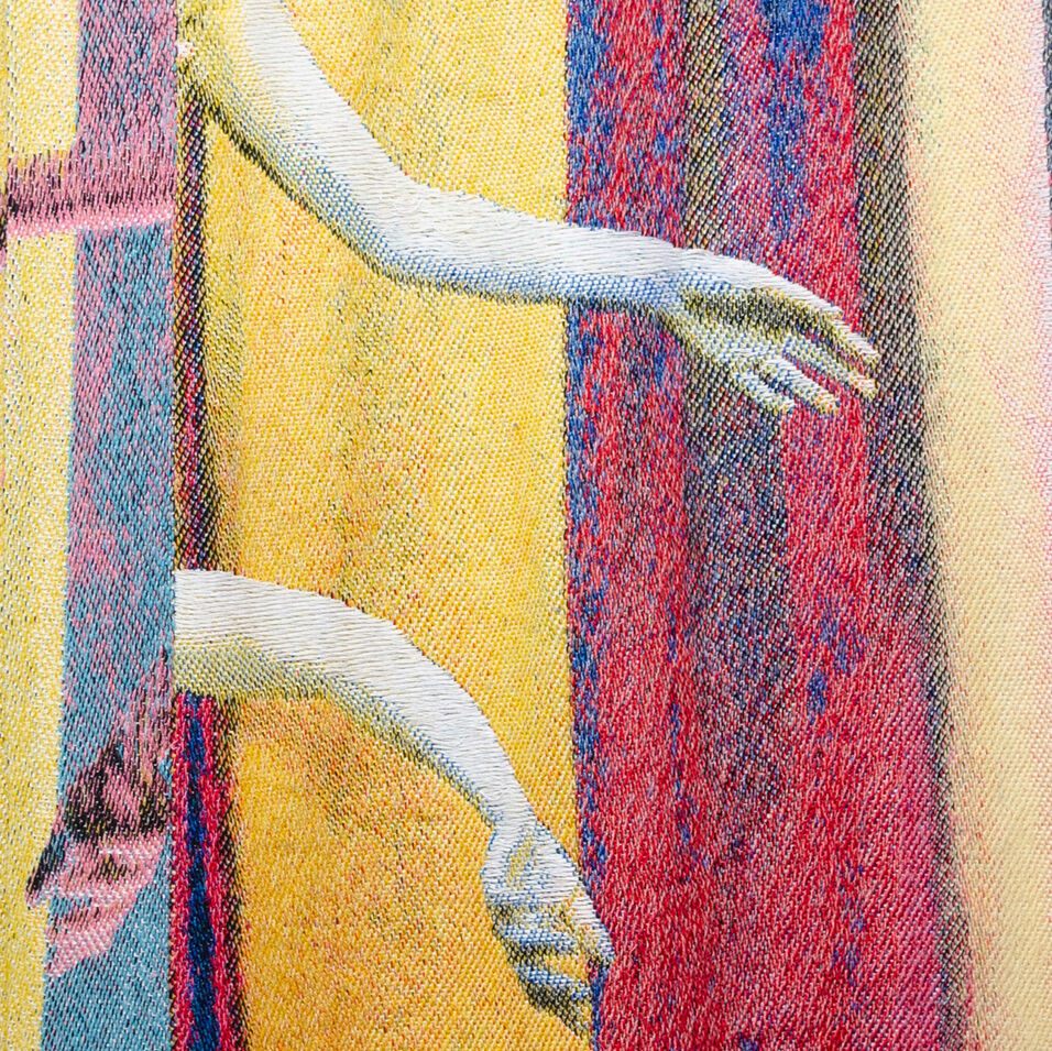 A detail of woven cloth with two arms reaching out from behind curtains.