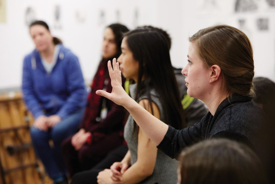 A group of students speaking.
