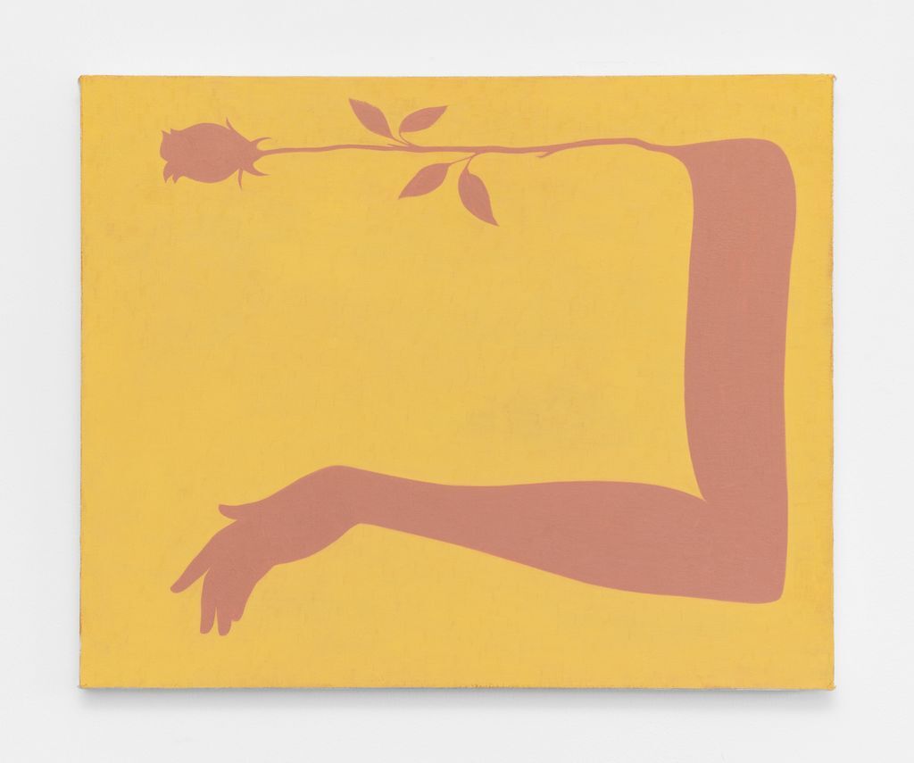 Image shows a rectangular painting with a mustard yellow background and a muted pink rose along the top edge morphing into a bent arm along the right side and bottom of the canvas.