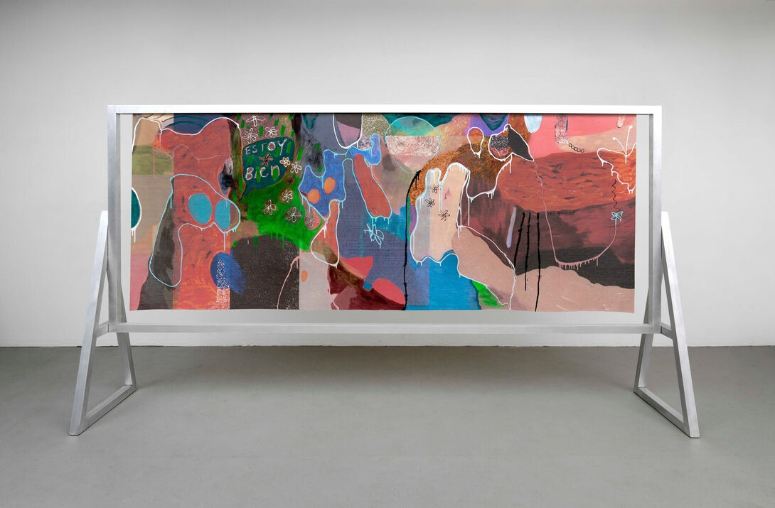 A colorful abstract canvas in a modern exhibition room