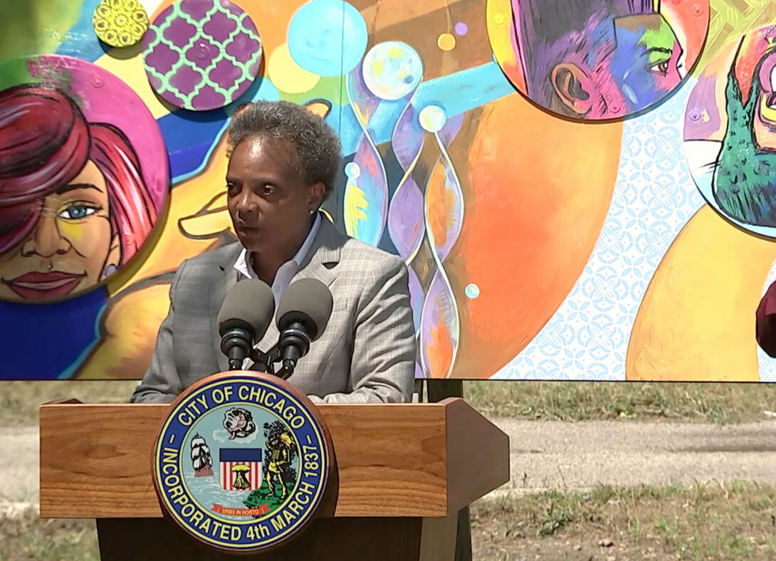Standing in front of the mural The Cool, Mayor Lori Lightfoot announces a beautification effort in partnership with Showtime, the network behind The Chi. Image courtesy of Pascal Sabino/Block Club Chicago.